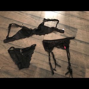 Black lace bra and underwear set with garter belt